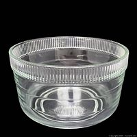 side view showing ribbed rim and clear glass body