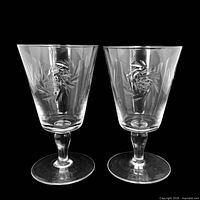 Two matching pinwheel cut crystal goblets front view
