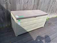 Front and side view of the Keter deck box showing full item