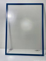 Front view of blue aluminum frame with acrylic panes