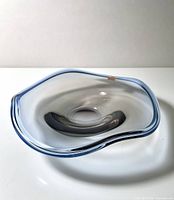 Top view of Orrefors Tan-si bowl showing layered blue/grey glass and free-form rim