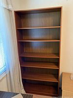 Front view showing full height and shelf count