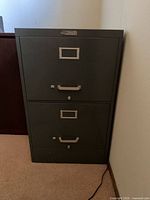 Front view of gray two-drawer metal filing cabinet