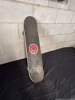 Top view showing black griptape and logo