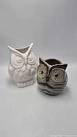 Both ceramic owl planters front view