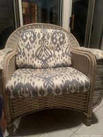 Wicker armchair with patterned cushions (appears unrelated)