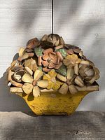 Front view of painted metal flower wall decor