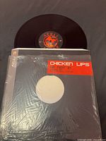 Front of shrink-wrapped Azuli sleeve with record partially visible