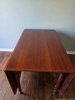 Top view of solid cherry table with both leaves raised