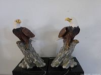 Front view of both eagle bookends on marble bases