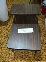 Top and lower shelves of two-tier bedside table