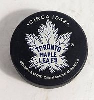 Front view showing maple leaf logo, Circa 1942 text and Molson Export sponsor note