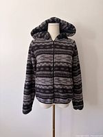 Front view of gray/black hooded fleece jacket on mannequin