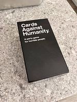 Cards Against Humanity base set box, lid closed