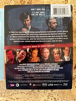 Back of slipcase detailing content, bonus features, barcodes
