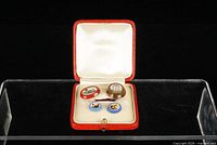 Open ring box showing four micro mosaic plaques