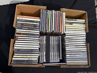 Open box showing three columns of stacked CDs