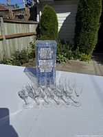 Group of glasses with original box on table