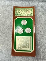 Display card holding three 1943 steel wheat cents