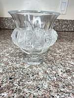 Front view showing clear crystal bowl with frosted fruit relief and pedestal base