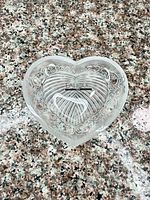 Top view of heart-shaped Lalique crystal dish showing pattern and label