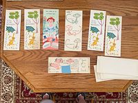 All seven cards laid out with six envelopes
