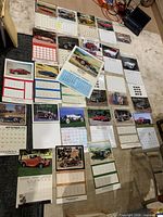 All calendars laid out showing variety of images and dates