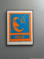 Full view of framed screen print on wall