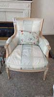 Full front view of armchair with pillow
