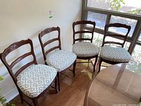 all four chairs side by side showing overall design and cushions