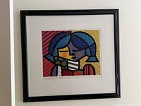 Framed Britto silkscreen on wall
