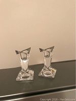 Pair of clear geometric Rosenthal crystal candlesticks, angled design.