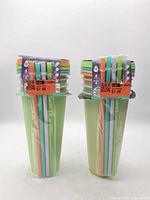 Two sealed 4-packs of TAL tumblers with bundled straws