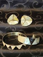 Group shot of both bracelets and earrings displaying shell mosaic patterns