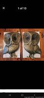 Front view of both owl plaques side by side on table