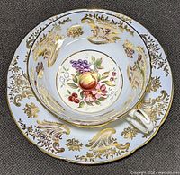 Top view of tea cup nested in saucer showing pattern and colours