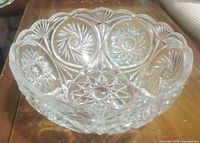 Side view of clear cut crystal bowl showing pattern and scalloped rim