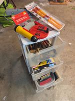 overall view of storage unit with packaged items on top and open drawers