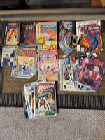 Full lot overview showing stacks of comics and paperbacks