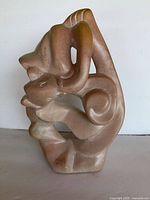 Front view of resin abstract sculpture showing overall form and colors