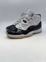 Three-quarter front view of both shoes showing uppers and soles
