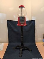 Full view of Continental gumball machine on pedestal stand