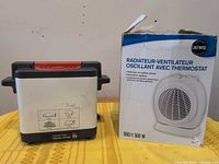 SEB fryer beside boxed Likewise heater