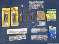 Overview of entire lot on blue background showing all tackle items
