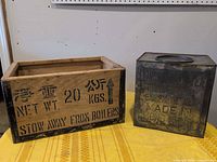 Metal tea canister and wooden crate side by side