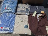 Six folded polo shirts displayed; two in packaging, four loose