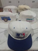 All five caps front view highlighting logos