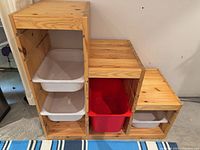 Front angled view showing wooden frame and bins