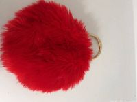 Front view showing red faux fur and round shape