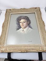 Framed pastel portrait showing full artwork and frame